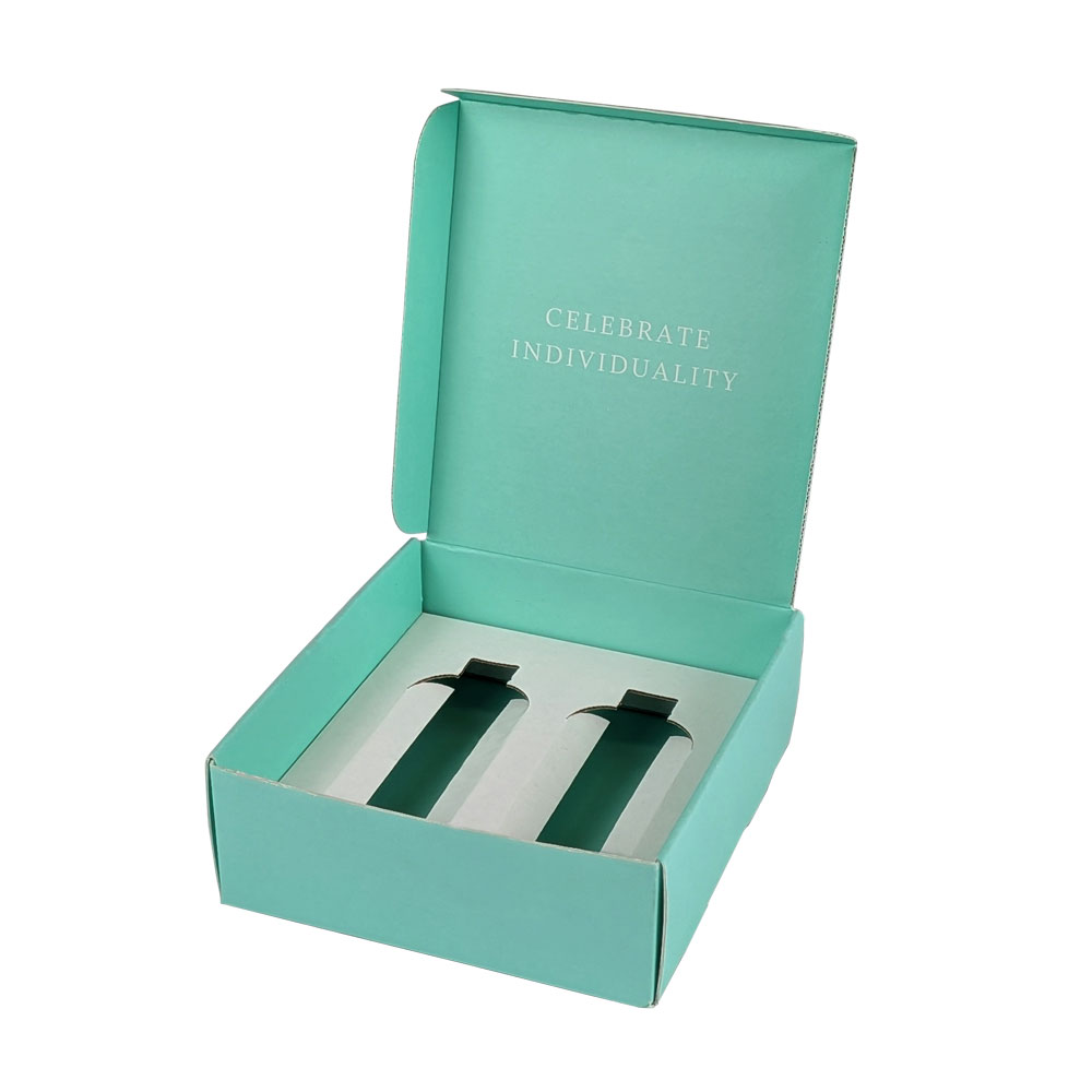 Turquoise e-commerce packaging box with a message "Celebrate Individuality" and slots for product placement.