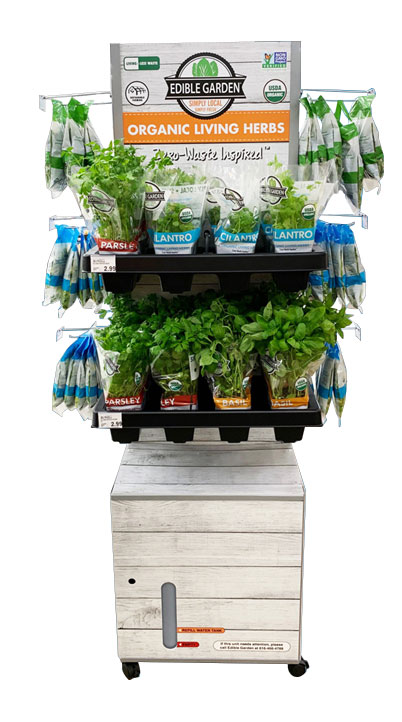 Display featuring organic living herbs, including parsley and cilantro, promoting eco-friendly gardening solutions.